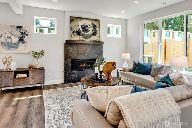 16215 Simonds Rd NE Unit 3, Kenmore, WA 98028 - living area featuring healthy amount of natural light, wood finished floors, recessed lighting, and a fireplace