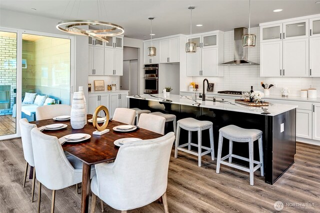 16215 Simonds Rd NE Unit 3, Kenmore, WA 98028 - dining space featuring wood finished floors, recessed lighting, and a chandelier