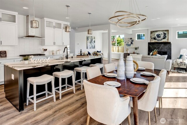 16215 Simonds Rd NE Unit 3, Kenmore, WA 98028 - dining space featuring light wood-style floors, a chandelier, and recessed lighting