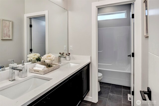 16215 Simonds Rd NE Unit 3, Kenmore, WA 98028 - bathroom featuring toilet, double vanity, and tile patterned flooring