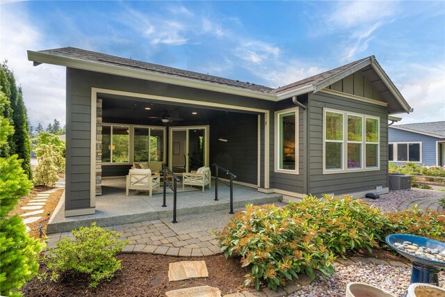 14419 190th Avenue Ct E, Bonney Lake, WA 98391 - back of property featuring a patio, board and batten siding, ceiling fan, and central AC