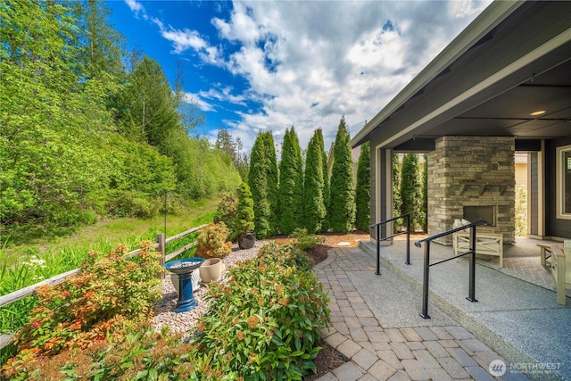 14419 190th Avenue Ct E, Bonney Lake, WA 98391 - view of patio / terrace with an outdoor stone fireplace