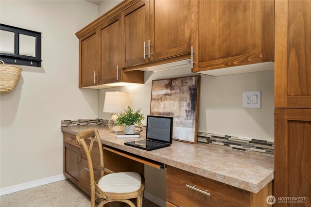 14419 190th Avenue Ct E, Bonney Lake, WA 98391 - home office featuring built in desk, baseboards, and light tile patterned floors