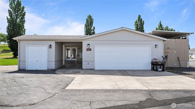 10615 SE Handicap Dr, Warden, WA 98857 - single story home with french doors, an attached garage, driveway, and roof with shingles