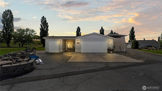 10615 SE Handicap Dr, Warden, WA 98857 - view of front of home featuring a garage and driveway