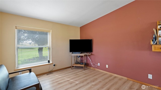 10615 SE Handicap Dr, Warden, WA 98857 - living area featuring wood finished floors, baseboards, and lofted ceiling