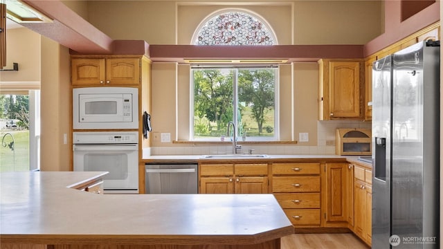 10615 SE Handicap Dr, Warden, WA 98857 - kitchen with appliances with stainless steel finishes, a sink, light countertops, and healthy amount of natural light