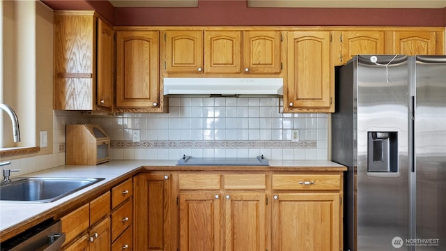 10615 SE Handicap Dr, Warden, WA 98857 - kitchen with stainless steel refrigerator with ice dispenser, exhaust hood, dishwasher, a sink, and light countertops