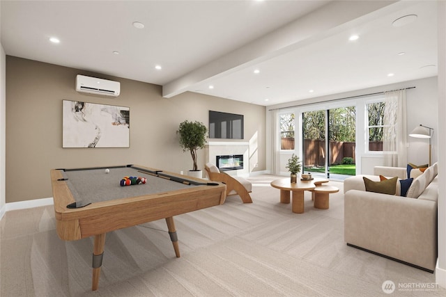 14480 133rd Pl NE, Woodinville, WA 98072 - recreation room with a wall unit AC, recessed lighting, light colored carpet, a glass covered fireplace, and baseboards
