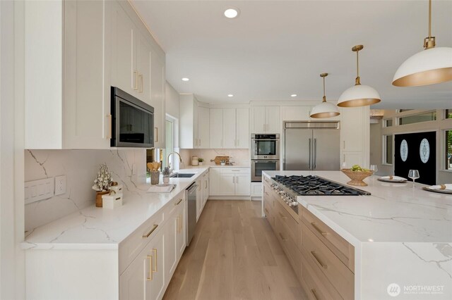 12805 Ruggs Lake Rd, Everett, WA 98208 - kitchen featuring stainless steel appliances, recessed lighting, light wood finished floors, tasteful backsplash, and white cabinets