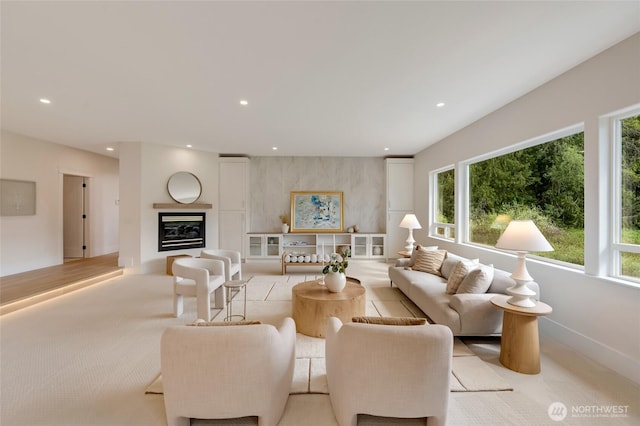 12805 Ruggs Lake Rd, Everett, WA 98208 - living area featuring plenty of natural light, light carpet, recessed lighting, and a glass covered fireplace