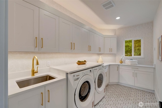 12805 Ruggs Lake Rd, Everett, WA 98208 - laundry area featuring washing machine and clothes dryer, cabinet space, recessed lighting, and light floors