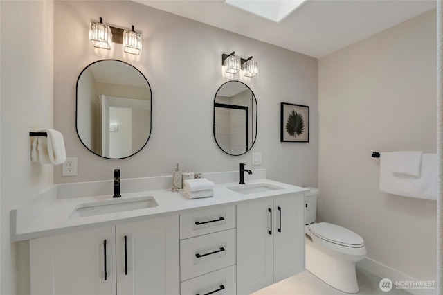 12805 Ruggs Lake Rd, Everett, WA 98208 - bathroom featuring toilet, tile patterned floors, double vanity, and baseboards