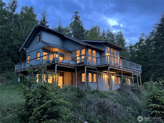 91 Coastline Dr, Orcas Island, WA 98279 - back of house with board and batten siding and a wooden deck