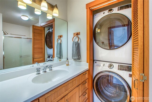 91 Coastline Dr, Orcas Island, WA 98279 - bathroom featuring estacked washer and dryer, vanity, and a shower with door