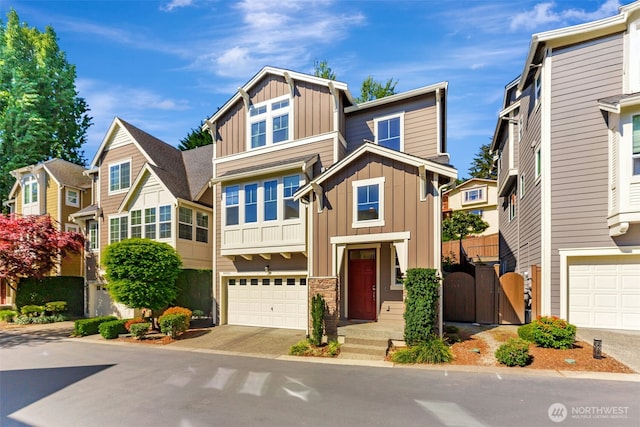 9831 NE 138th Pl, Kirkland, WA 98034 - view of front facade featuring board and batten siding, a garage, driveway, and a gate