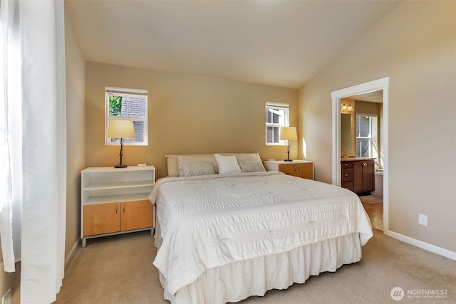 9831 NE 138th Pl, Kirkland, WA 98034 - bedroom featuring light colored carpet, baseboards, vaulted ceiling, and ensuite bath