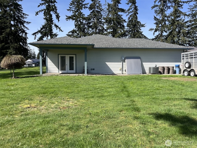 137 La Due Cemetery Rd, Onalaska, WA 98570 - rear view of property with french doors, central air condition unit, a lawn, and roof with shingles