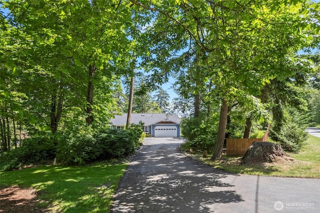 1555 Silver Lake Rd, Oak Harbor, WA 98277 - view of property hidden behind natural elements featuring driveway and a detached garage