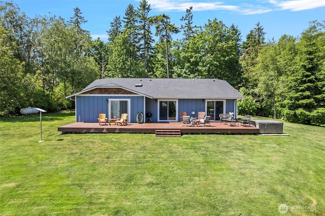1555 Silver Lake Rd, Oak Harbor, WA 98277 - back of property with a wooden deck, a lawn, board and batten siding, and a shingled roof
