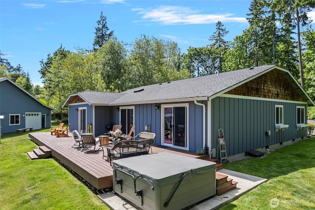 1555 Silver Lake Rd, Oak Harbor, WA 98277 - back of property with a hot tub, board and batten siding, a deck, a shingled roof, and a yard