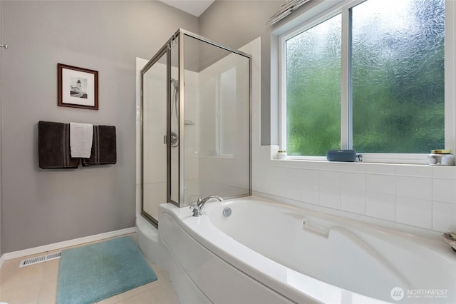 1555 Silver Lake Rd, Oak Harbor, WA 98277 - full bath featuring a garden tub, a shower stall, tile patterned flooring, and baseboards