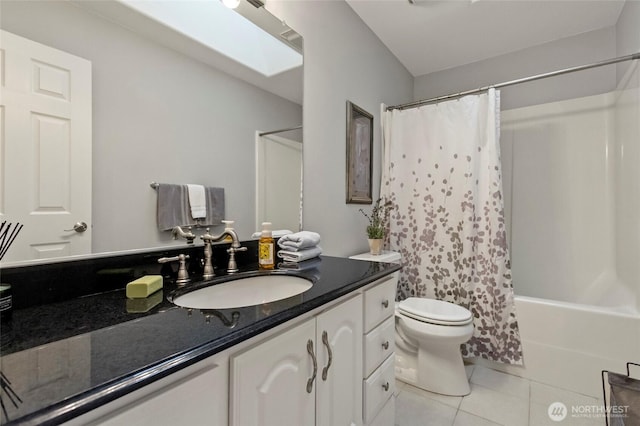 1555 Silver Lake Rd, Oak Harbor, WA 98277 - full bath featuring tile patterned flooring, vanity, toilet, shower / tub combo with curtain, and a skylight