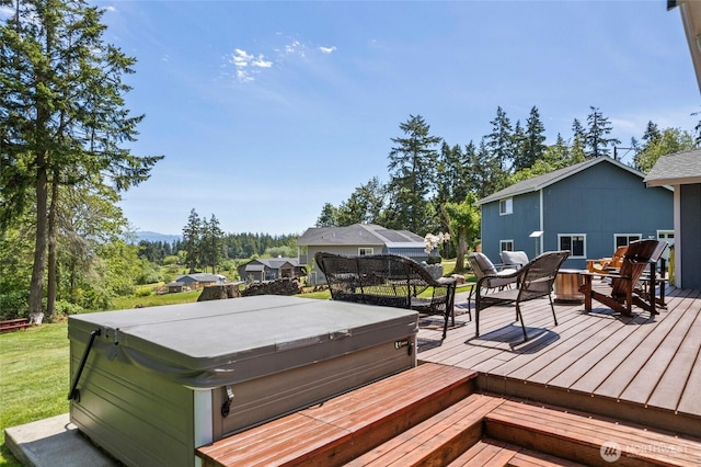 1555 Silver Lake Rd, Oak Harbor, WA 98277 - wooden deck with a hot tub and outdoor dining area
