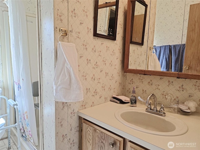 3516 Harrison Ave Unit H, Centralia, WA 98531 - bathroom featuring wallpapered walls and vanity