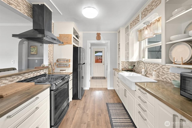 1060 Peace Portal Dr, Blaine, WA 98230 - kitchen with open shelves, extractor fan, freestanding refrigerator, stainless steel electric range oven, and ornamental molding