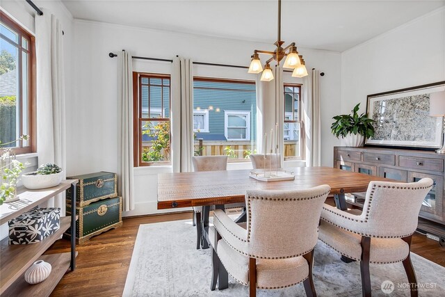 3708 N Madison St, Tacoma, WA 98407 - dining area with wood finished floors, crown molding, and a chandelier