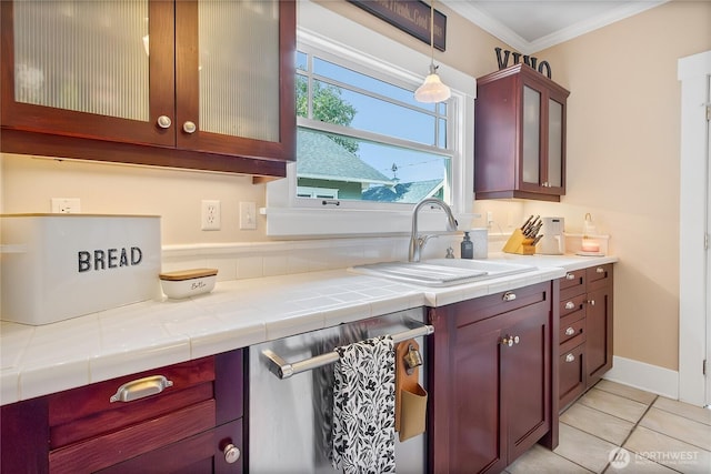 3708 N Madison St, Tacoma, WA 98407 - kitchen featuring dishwasher, crown molding, light tile patterned flooring, a sink, and glass insert cabinets