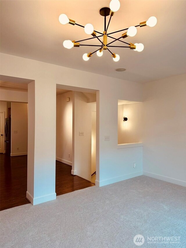 4660 NE 3rd Ct Unit J3, Renton, WA 98059 - carpeted empty room with a chandelier, washer / dryer, and baseboards