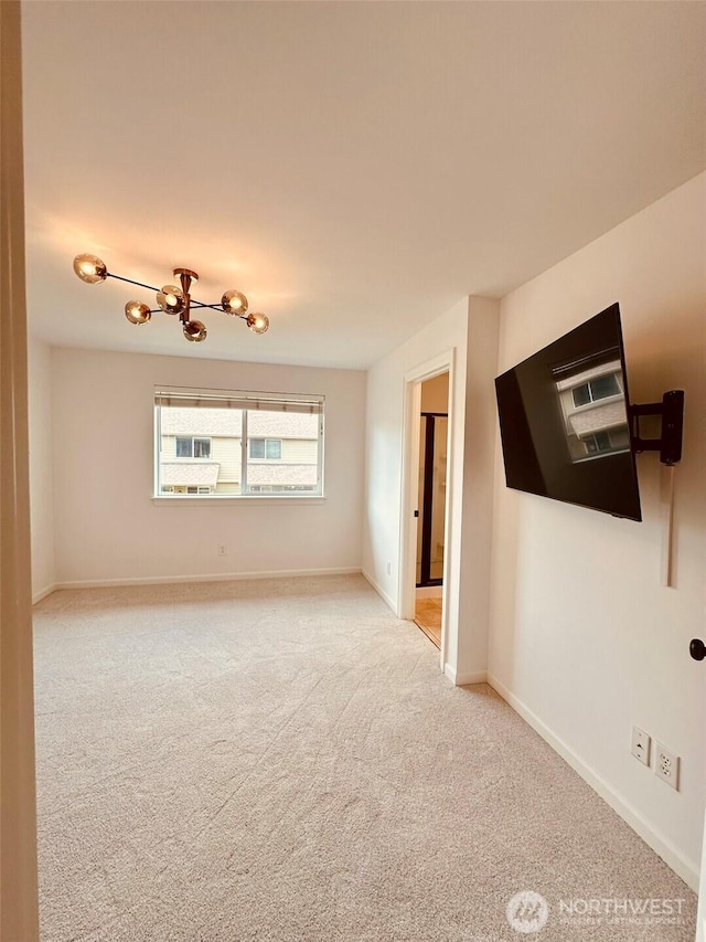 4660 NE 3rd Ct Unit J3, Renton, WA 98059 - carpeted spare room featuring baseboards