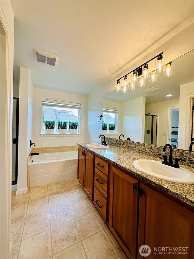 4660 NE 3rd Ct Unit J3, Renton, WA 98059 - bathroom with a shower stall, a bath, tile patterned floors, and double vanity