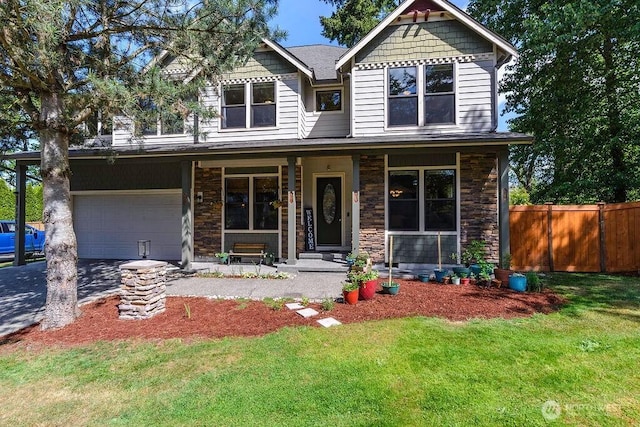 1715 131st St S, Tacoma, WA 98444 - craftsman inspired home featuring a porch, stone siding, a garage, and driveway