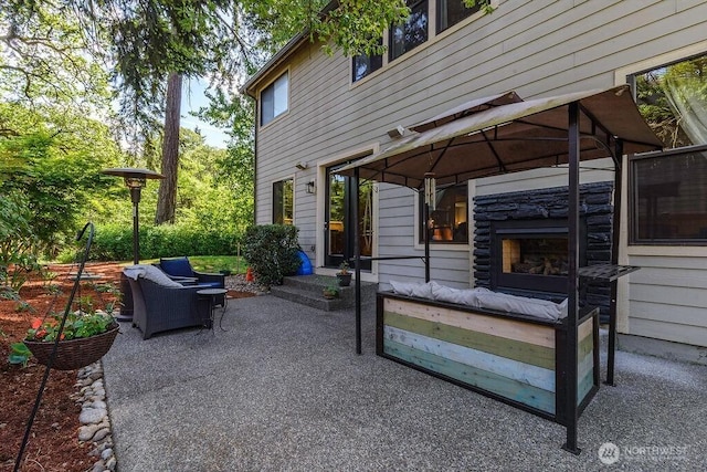 1715 131st St S, Tacoma, WA 98444 - view of patio with an outdoor living space with a fireplace and a gazebo