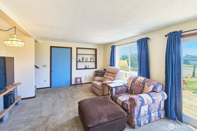 33612 I St, Ocean Park, WA 98640 - living area featuring carpet floors, a textured ceiling, and baseboards