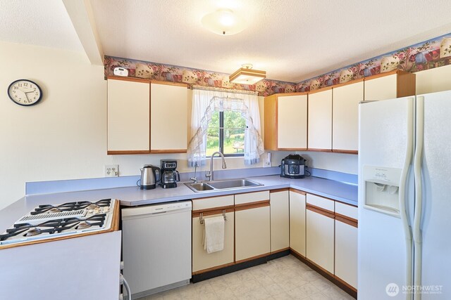 33612 I St, Ocean Park, WA 98640 - kitchen featuring white appliances, a sink, light countertops, and light flooring