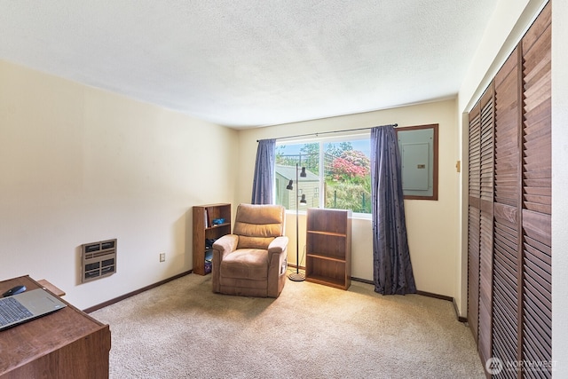 33612 I St, Ocean Park, WA 98640 - living area featuring carpet floors, electric panel, baseboards, heating unit, and a textured ceiling
