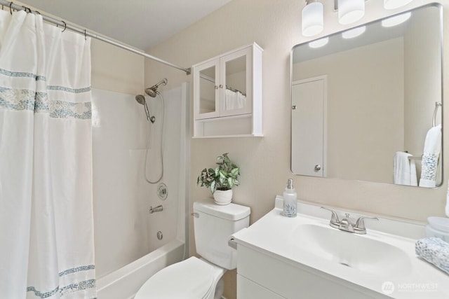 full bath featuring vanity, toilet, and shower / tub combo