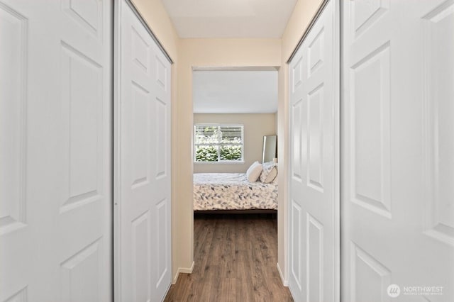 hallway featuring dark wood finished floors