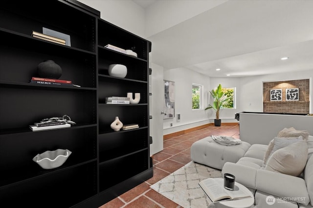 tiled living room with recessed lighting