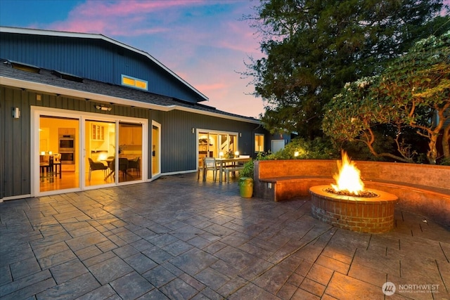 view of patio with an outdoor fire pit
