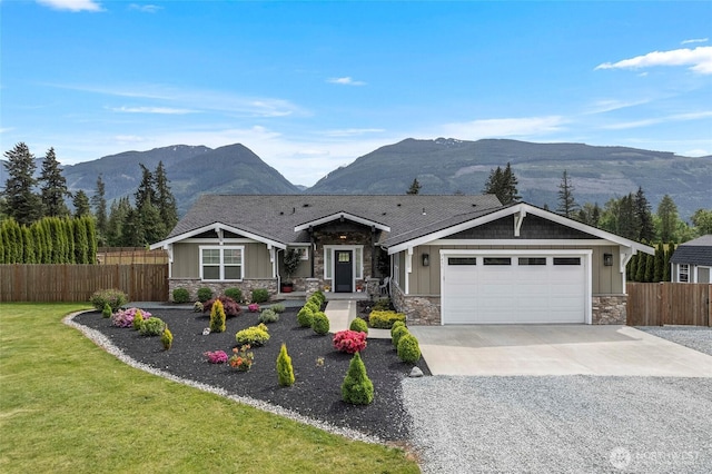 view of front facade with stone siding and a mountain view