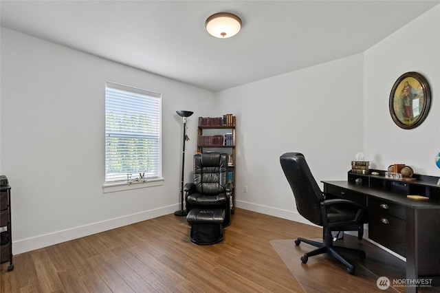home office with wood finished floors and baseboards
