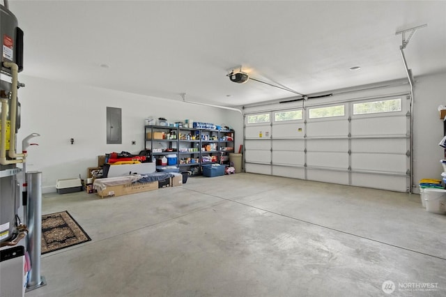garage featuring a garage door opener and electric panel