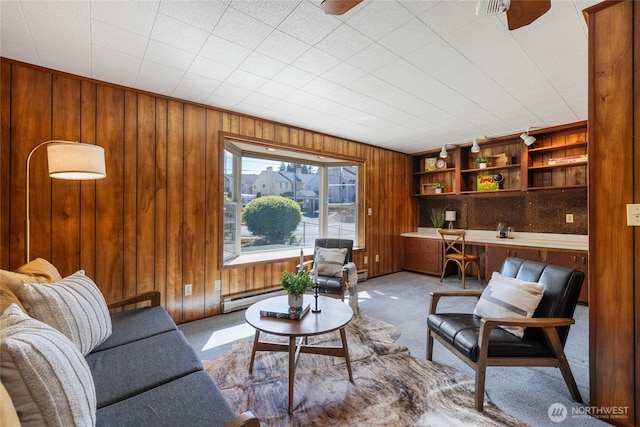1102 S Villard St, Tacoma, WA 98465 - living room with carpet, wood walls, and a baseboard radiator