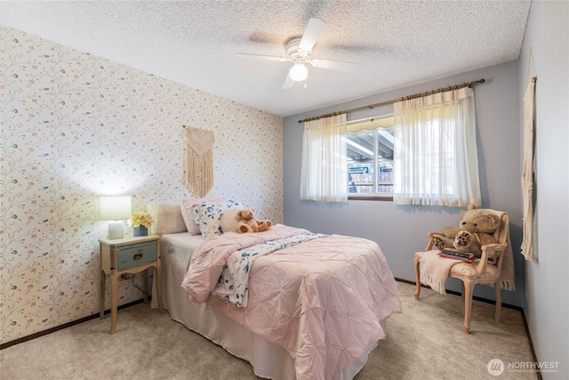 1102 S Villard St, Tacoma, WA 98465 - carpeted bedroom featuring a textured ceiling, wallpapered walls, and a ceiling fan