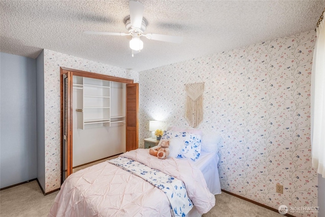 1102 S Villard St, Tacoma, WA 98465 - bedroom featuring wallpapered walls, carpet, a closet, a textured ceiling, and a ceiling fan